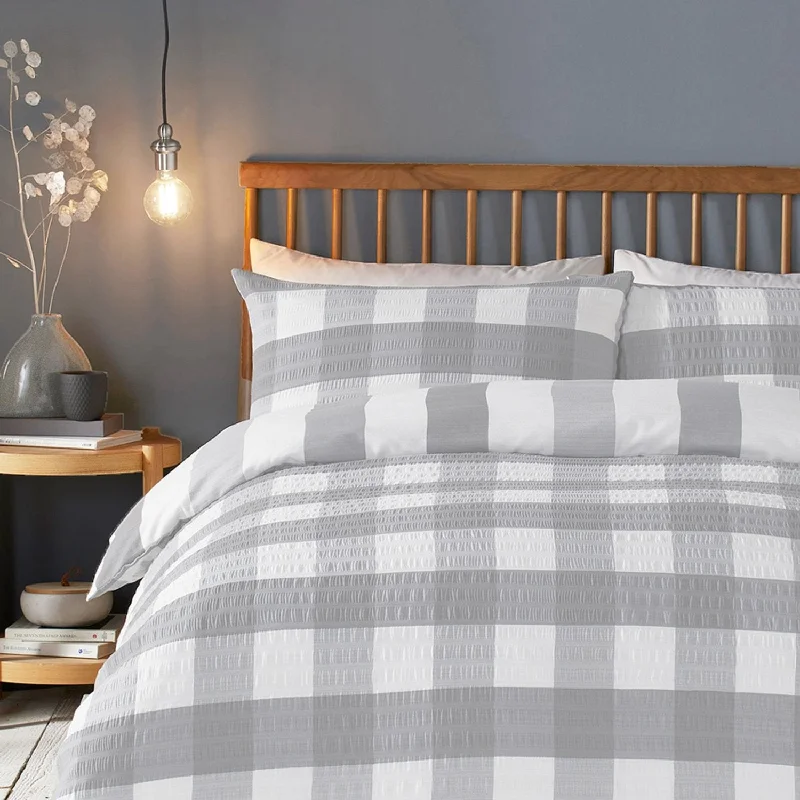 Patchwork duvet covers with a variety of fabric pieces sewn together for a rustic charmGingham Silver Seersucker Duvet Set